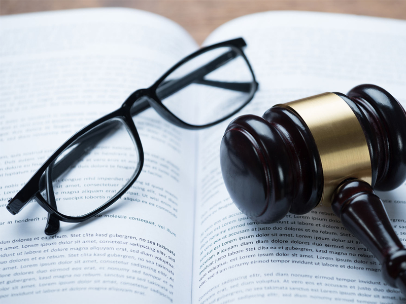 High angle view of mallet eyeglasses legal book in courtroom