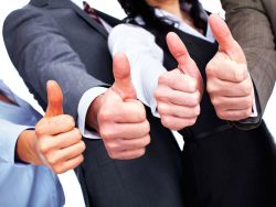 Business team with thumbs up