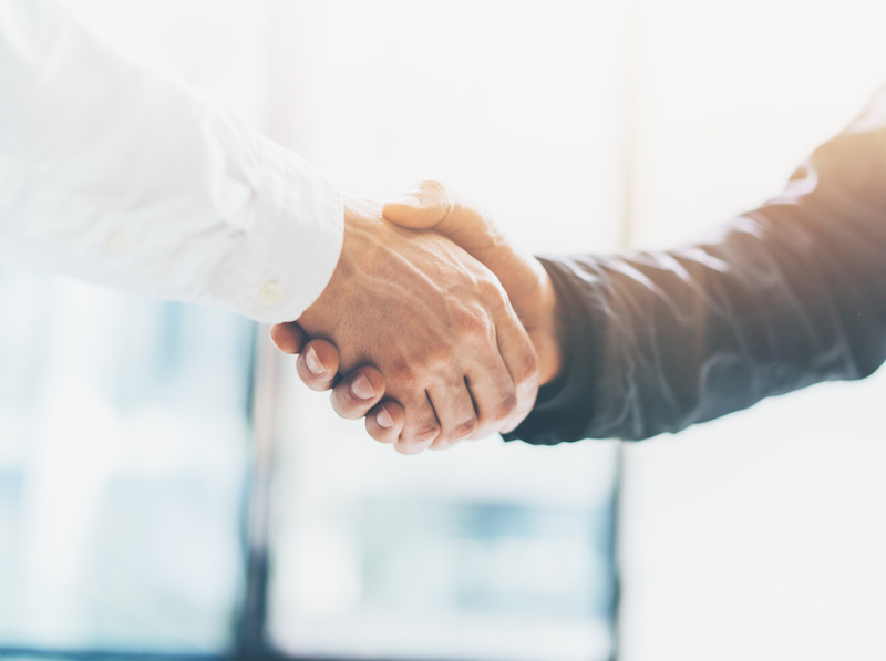 Business partnership meeting. Picture businessmans handshake. Successful businessmen handshaking after good deal. Horizontal, blurred (Business partnership meeting. Picture businessmans handshake. Successful businessmen handshaking after good deal. Ho