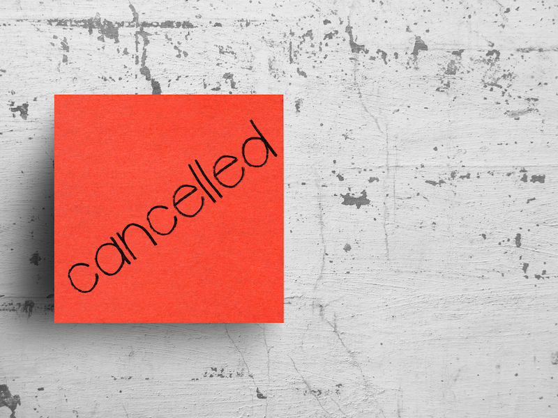 Sticky note on concrete wall, Cancelled