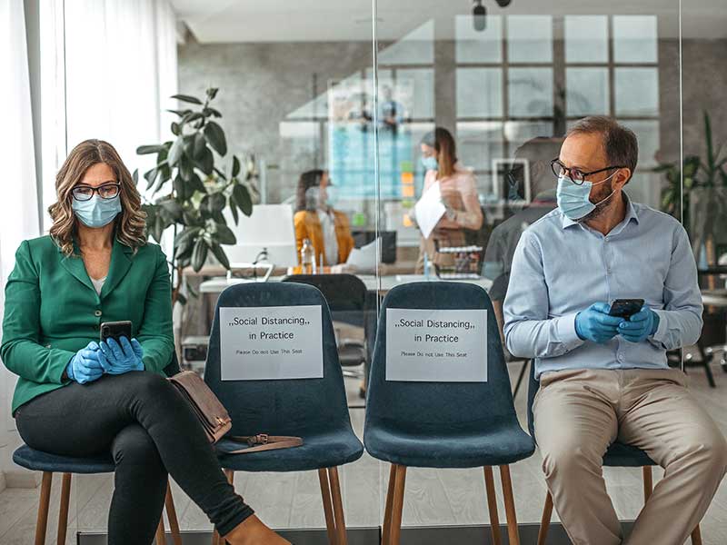 customers at a bank wearing masks