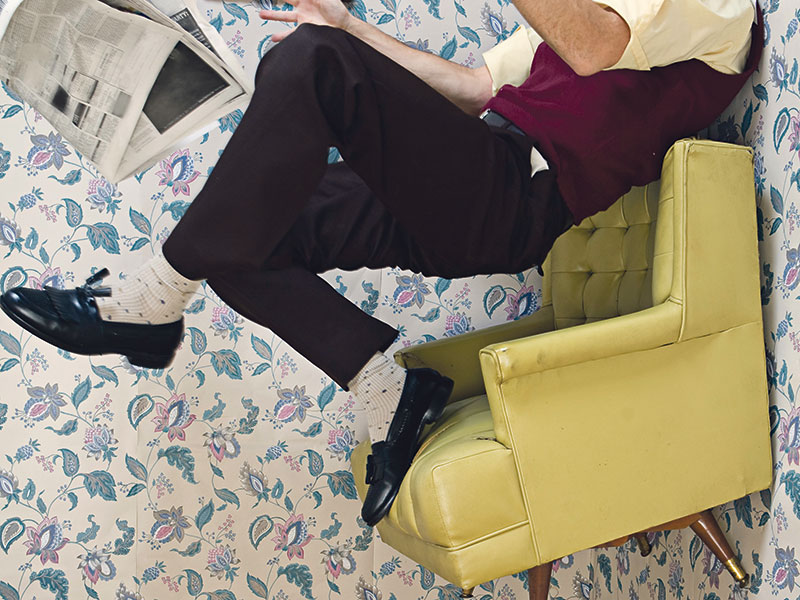 man floating in air, rug pulled out from beneath him