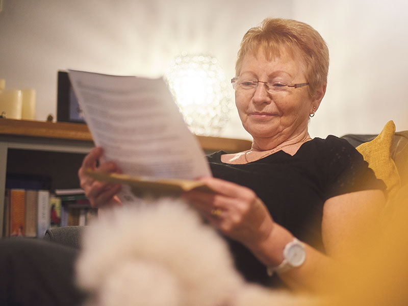 senior woman reading document