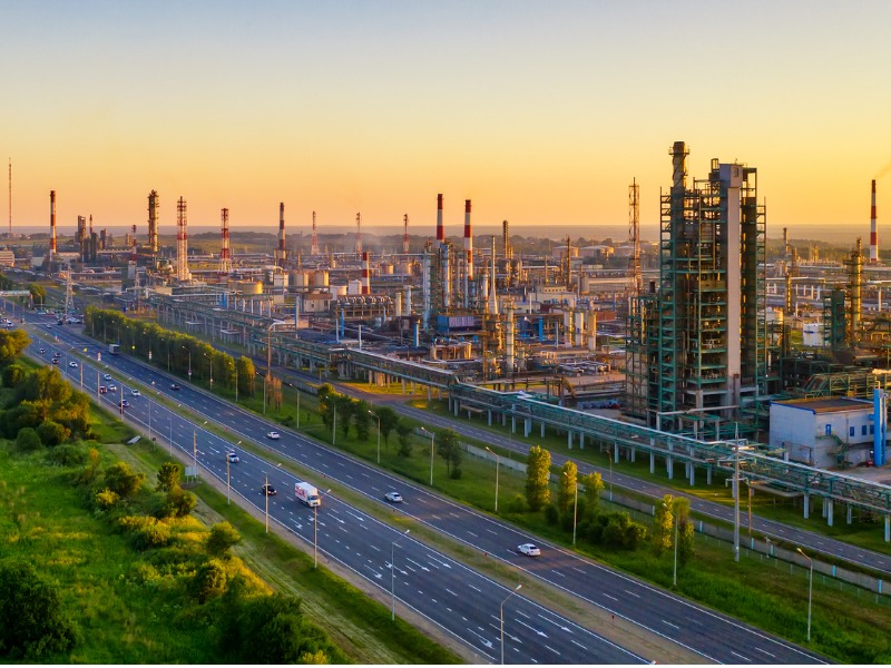 Aerial drone view of petrol industrial zone or oil refinery in Yaroslavl, Russia during sunset time.