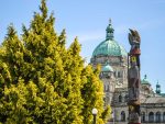 The Victoria government building beside an aboriginal totem pole.