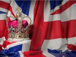 Royal golden crown with jewels on british flag. Symbols of UK United Kingdom