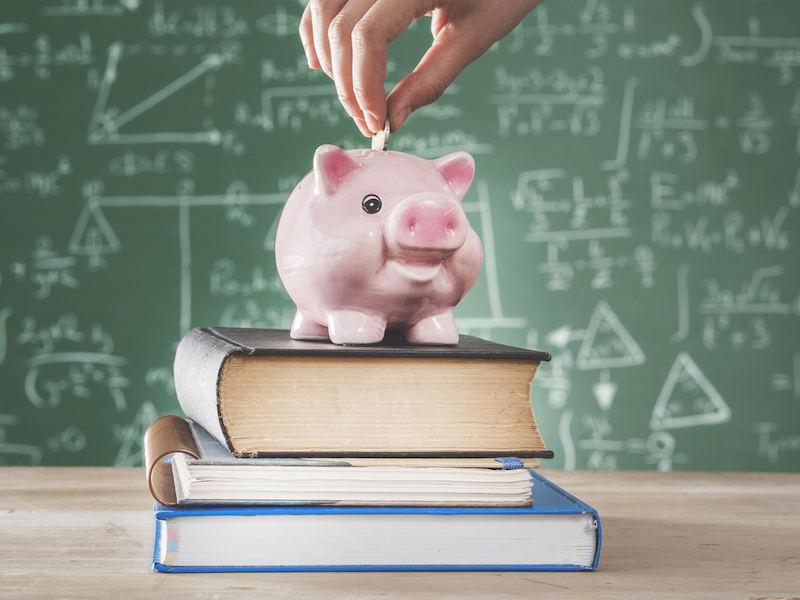 Piggy bank on books